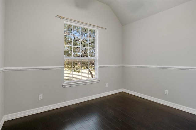 unfurnished room featuring vaulted ceiling and wood-type flooring