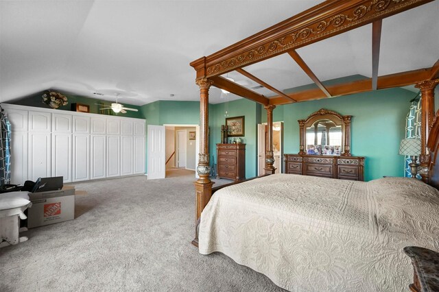 carpeted bedroom featuring lofted ceiling and ceiling fan