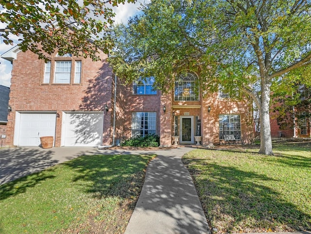 view of front of property featuring a garage and a front lawn