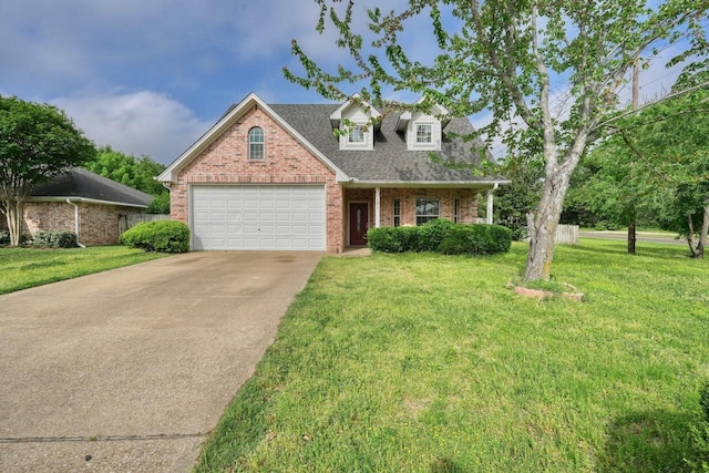 view of front of property featuring a garage and a front lawn