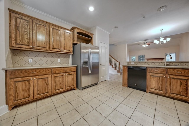 kitchen with pendant lighting, black dishwasher, stainless steel fridge, decorative backsplash, and light tile patterned floors