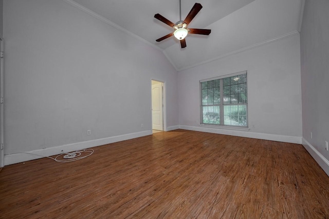 spare room with hardwood / wood-style flooring, crown molding, vaulted ceiling, and ceiling fan