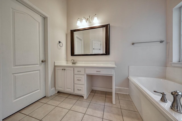 bathroom featuring a tub to relax in, tile patterned floors, and vanity