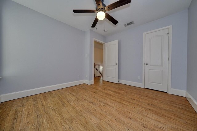 unfurnished bedroom featuring ceiling fan and light wood-type flooring