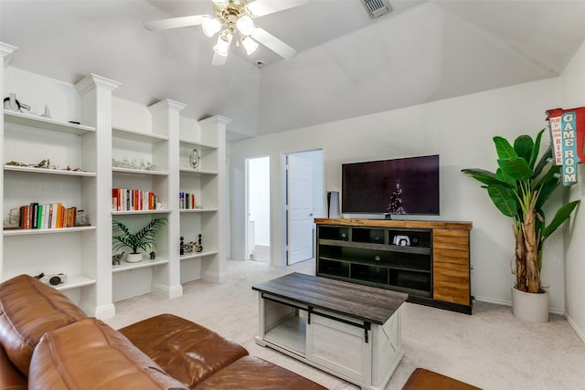 living area featuring light carpet, vaulted ceiling, visible vents, and a ceiling fan