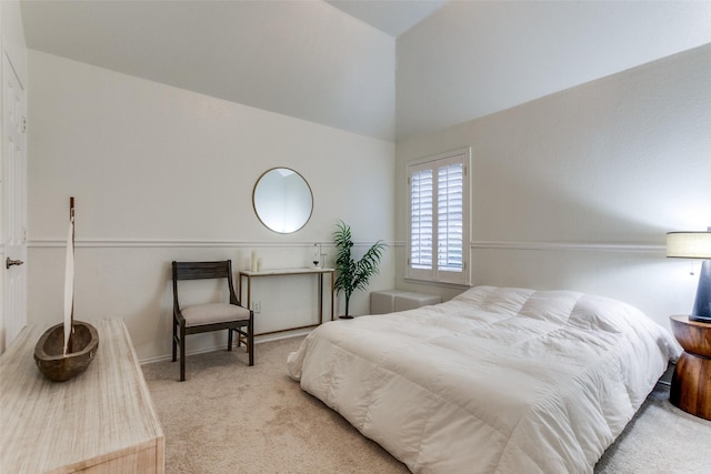 bedroom featuring carpet floors and vaulted ceiling