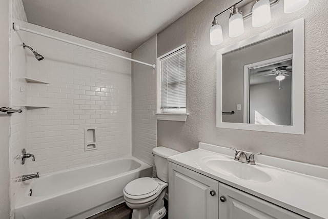 full bathroom featuring vanity, toilet, and tiled shower / bath