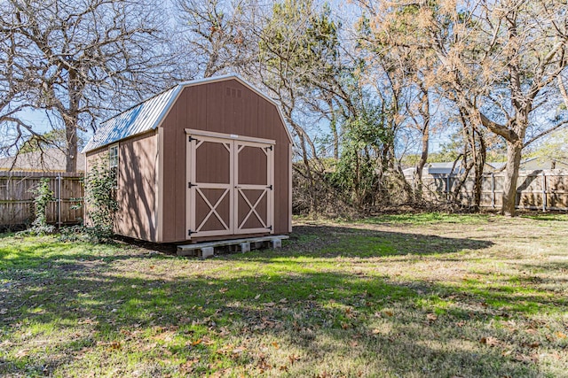 view of outbuilding with a lawn