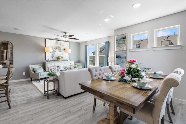 dining room featuring plenty of natural light, ceiling fan, and light hardwood / wood-style floors