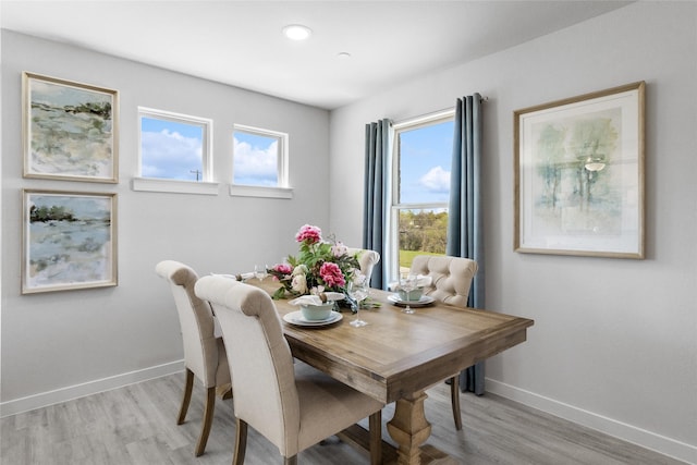 dining space featuring light hardwood / wood-style flooring