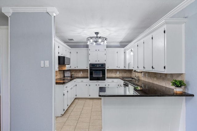 kitchen with black appliances, kitchen peninsula, white cabinets, and light tile patterned flooring