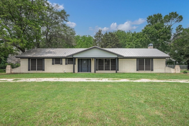 ranch-style home with a front yard