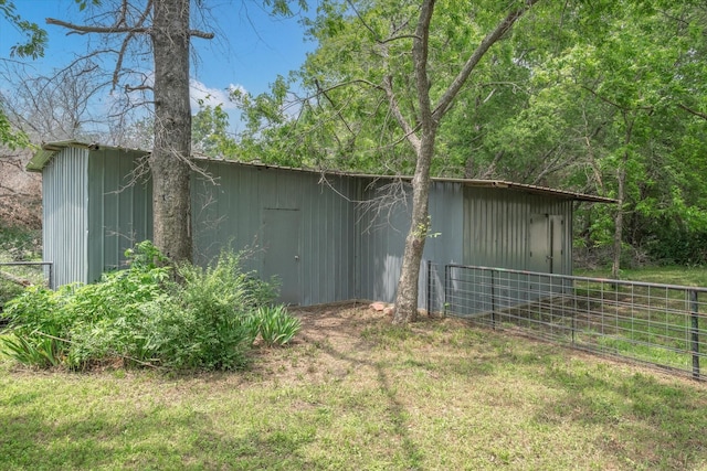 view of side of home with an outdoor structure