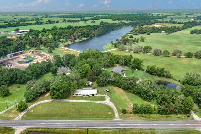 drone / aerial view featuring a water view and a rural view