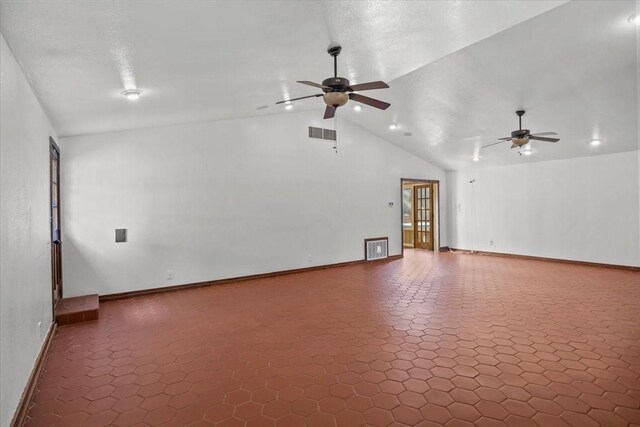 spare room featuring ceiling fan and lofted ceiling