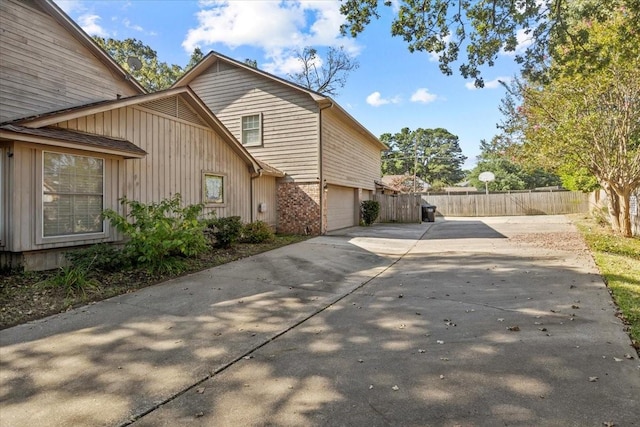 view of property exterior featuring a garage