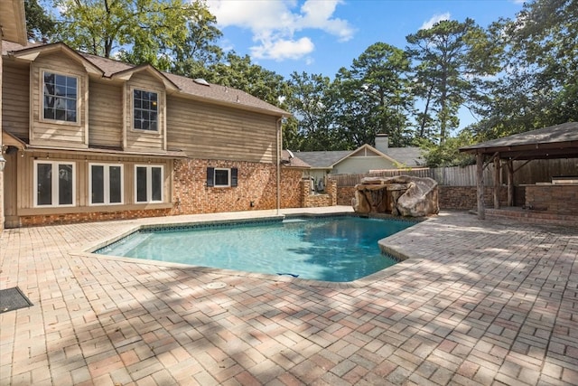 view of swimming pool with a gazebo and a patio