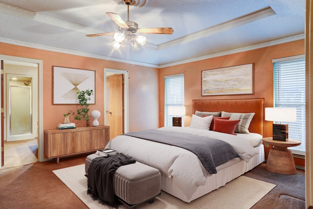 bedroom with ornamental molding, a raised ceiling, and carpet flooring