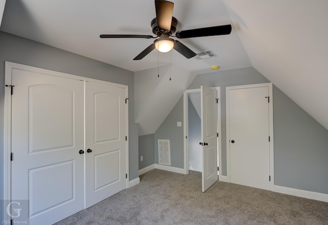 bonus room featuring lofted ceiling, light colored carpet, and ceiling fan