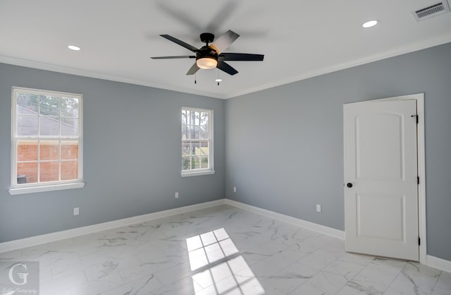 spare room featuring crown molding and ceiling fan