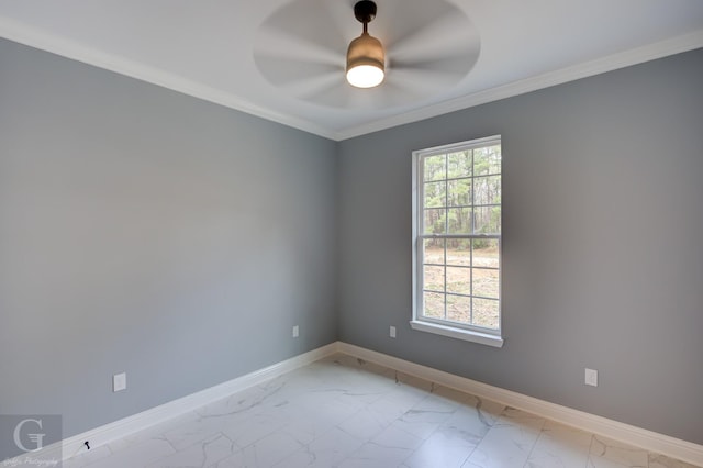 empty room featuring ceiling fan and ornamental molding