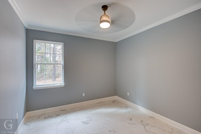 spare room featuring ceiling fan and ornamental molding