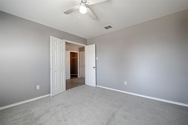 interior space featuring carpet flooring and ceiling fan