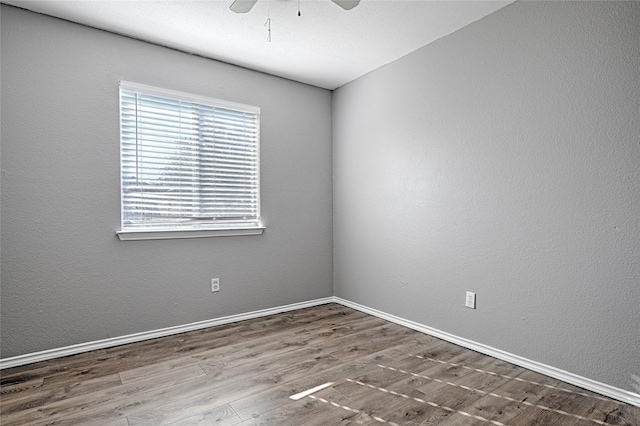 unfurnished room featuring hardwood / wood-style floors and ceiling fan