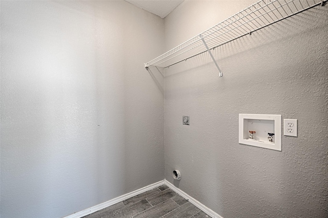 laundry room with washer hookup, dark wood-type flooring, and hookup for an electric dryer