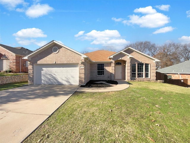 single story home featuring a front yard and a garage