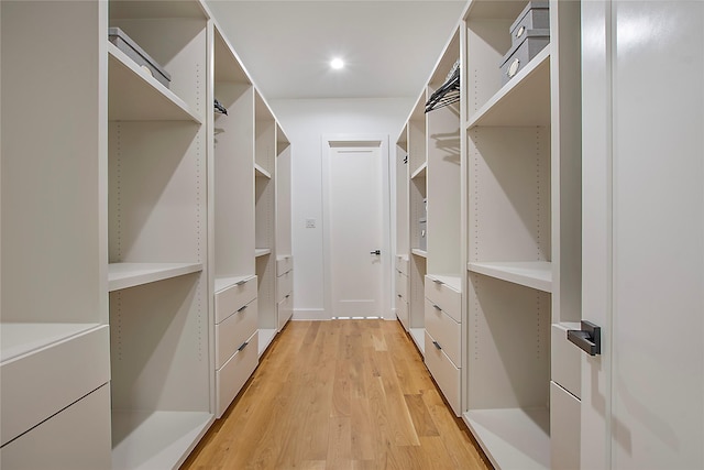 walk in closet featuring light hardwood / wood-style flooring