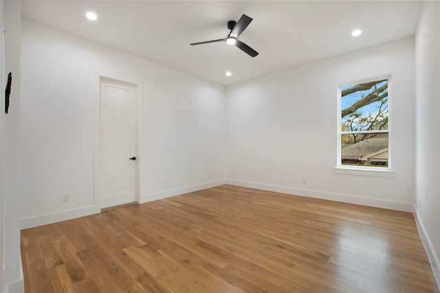 spare room featuring ceiling fan and light hardwood / wood-style flooring