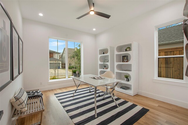 office featuring ceiling fan and light wood-type flooring