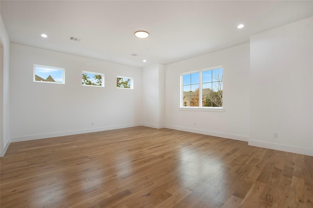 spare room with hardwood / wood-style floors