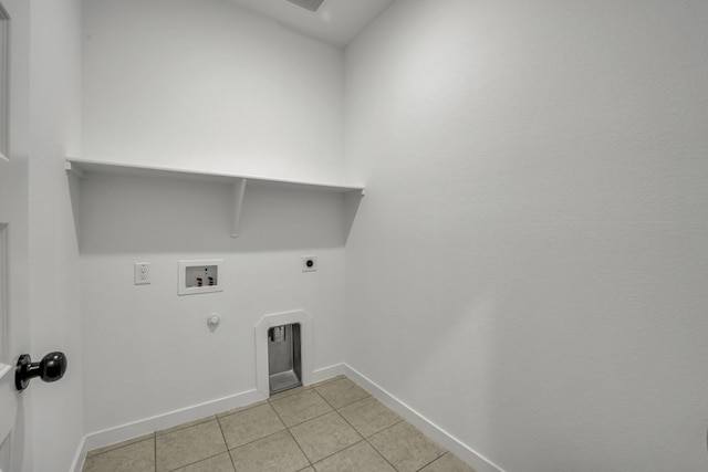 clothes washing area with hookup for an electric dryer, washer hookup, light tile patterned floors, and hookup for a gas dryer