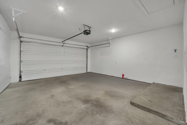 garage featuring a garage door opener