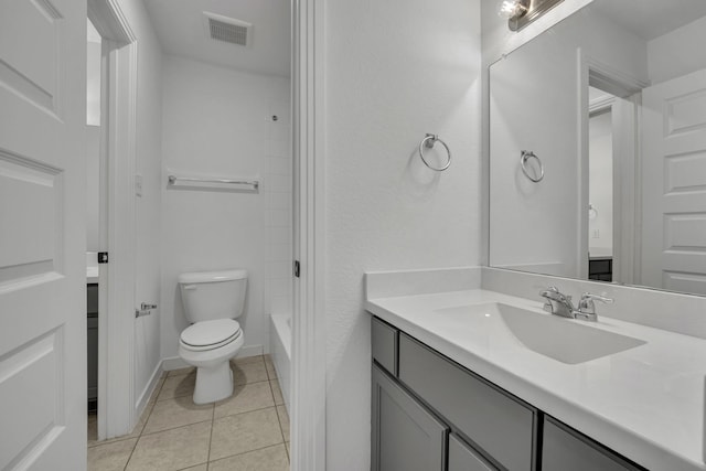 full bathroom with tile patterned floors, vanity, toilet, and shower / tub combination