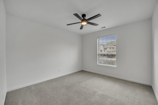 carpeted empty room with ceiling fan