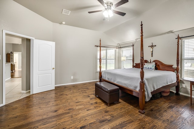 bedroom featuring vaulted ceiling, hardwood / wood-style floors, and ceiling fan