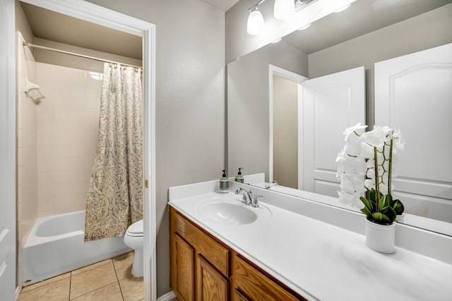 full bathroom featuring vanity, tile patterned floors, toilet, and shower / bath combo