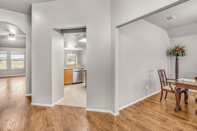 hall with light hardwood / wood-style flooring