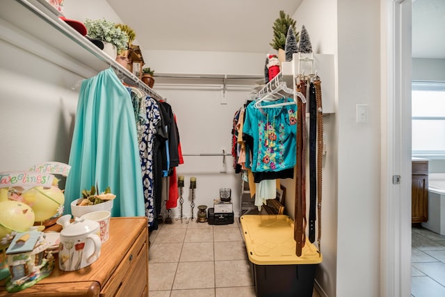 spacious closet with light tile patterned flooring