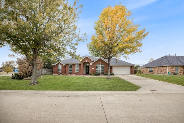 ranch-style home featuring a garage and a front yard