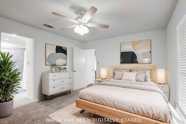 carpeted bedroom with ceiling fan