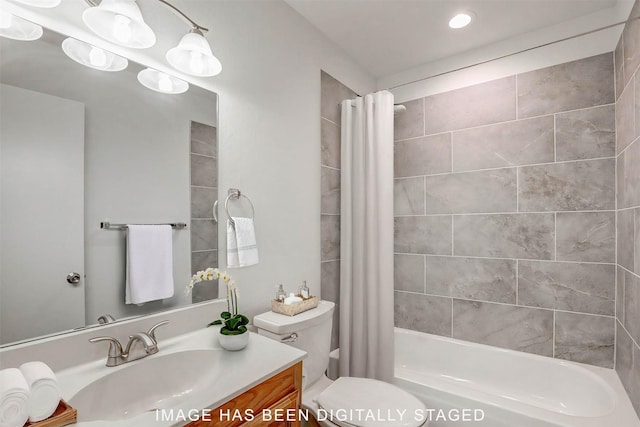 full bathroom with shower / bath combo with shower curtain, vanity, and toilet