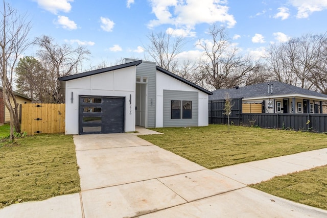 contemporary home with a garage and a front yard