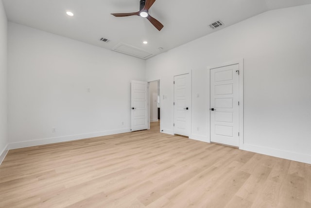 unfurnished bedroom with ceiling fan, light hardwood / wood-style floors, and lofted ceiling