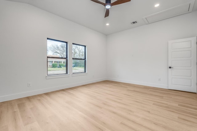 spare room featuring ceiling fan, light hardwood / wood-style flooring, and lofted ceiling