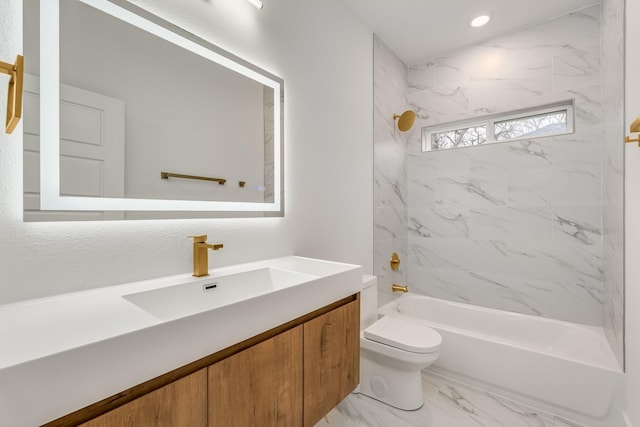 full bathroom with tiled shower / bath combo, toilet, and vanity