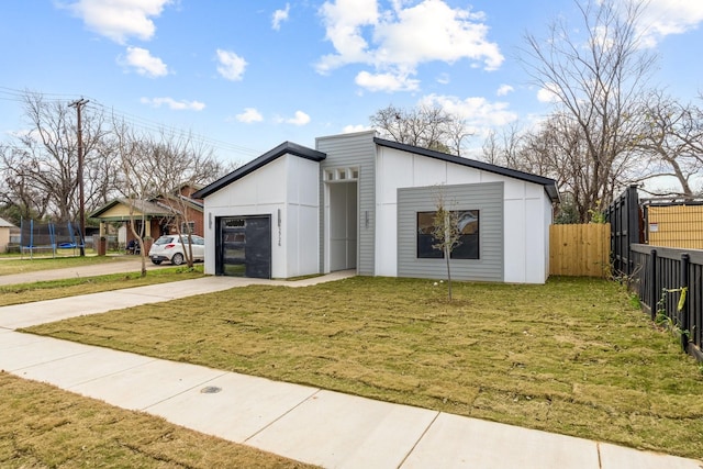 view of outbuilding featuring a lawn and a garage